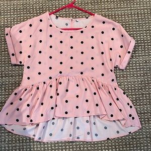 Pink peplum style top top with black polka dots